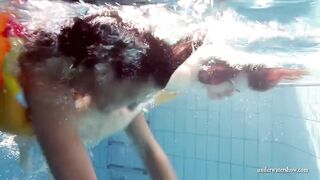 Mia and Petra strip eachother in the swimmingpool