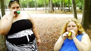 two bbws are balloon blowing and popping