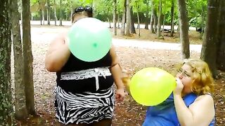 two bbws are balloon blowing and popping