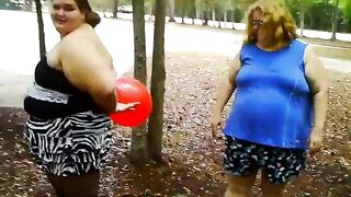 two bbws are balloon blowing and popping