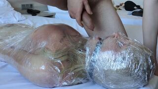 Cute Transsexual wrapped in plastic! Thrashing! Spunk fountain in her throat! Used til this babe cums!