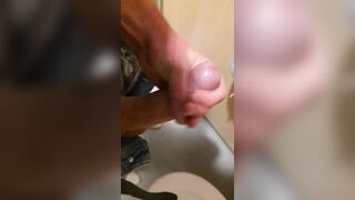 Wank in a public latrine building