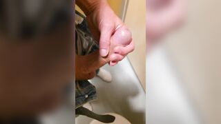 Wank in a public latrine building