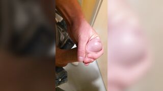 Wank in a public latrine building