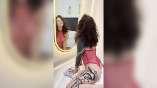 Tattooed booty widens wide during the time that licking mirror ?