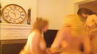 A lesbian threesome in the living room
