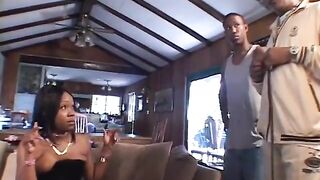 Ebony floozy in hawt boots rides a ramrod whilst sucking one more on the sofa