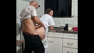 The maid got banged in the butt in the kitchen whilst washing the dishes.