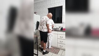 The maid got banged in the butt in the kitchen whilst washing the dishes.