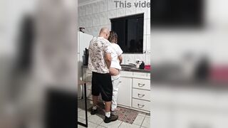 The maid got banged in the butt in the kitchen whilst washing the dishes.
