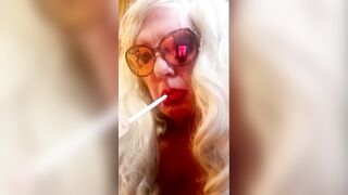 GRAND MOTHER LOVES TO SMOKE HER LENGTHY CIGARETTES AND RUB HER OILED LITTLE TITTIES