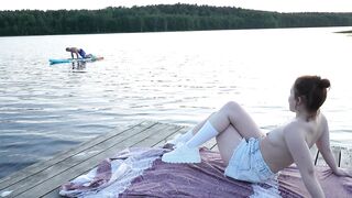 2 cuties took their clothing off on the lake. A passing surfer had sex in the open air.