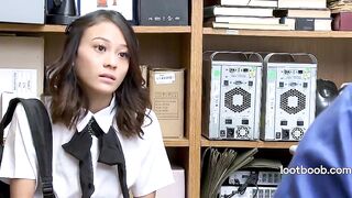 Small Oriental shoplifter screws security guard on the stockroom desk