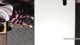 Small Oriental shoplifter screws security guard on the stockroom desk
