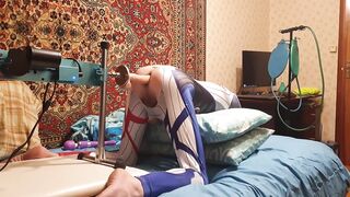 Femboy in an erotic suit Harley Quinn homemade amateur gets her gap banged by a giant sex tool on a Bang Machine