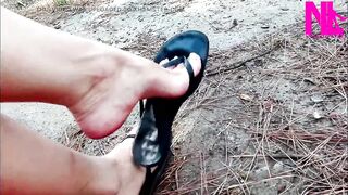 Mad Dangling in My Leather Ebony Flip Flops in a Park