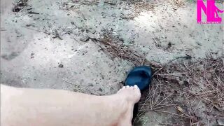 Mad Dangling in My Leather Ebony Flip Flops in a Park