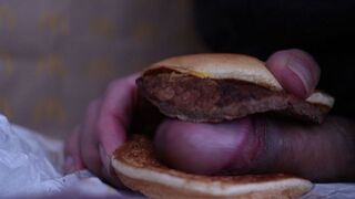 close up - screwing a cheeseburger