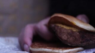 close up - screwing a cheeseburger