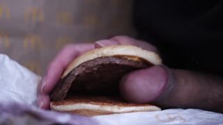 close up - screwing a cheeseburger