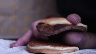 close up - screwing a cheeseburger