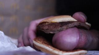 close up - screwing a cheeseburger