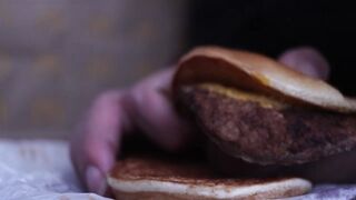 close up - screwing a cheeseburger