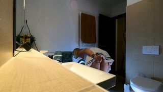 Super sexy tiny golden-haired cheerleader wears a short miniskirt with a watch throughout top to show her bazookas