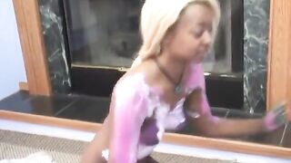 Cute golden-haired black cutie rubs blue body paint on allies boobs
