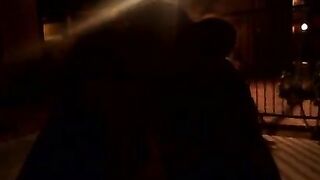 girls kiss in park