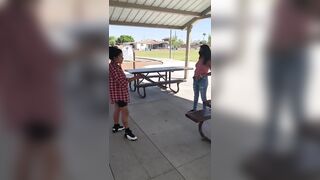 Mexican Girl gives her Friend a Spanking Bending over the Table