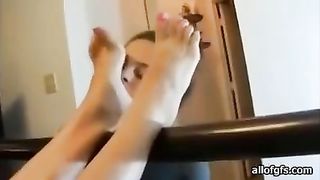 Submissive gal is licking her lesbian girlfriend's sexy feet