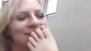 Three girls worshipping each other's feet outside