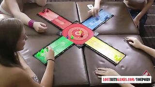 Four hot girls play a game, loser strips and more.