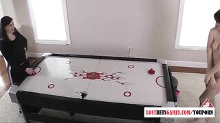 Two sexy girls play a game of strip air hockey