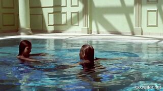 Swimming pool girls Irina and Olla having fun