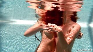 Swimming pool girls Irina and Olla having fun