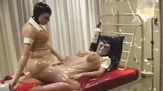 Hot Rubber Lesbians in Transparent Latex Outfits and Gas Masks Enjoys Breath Games in Clinic Room