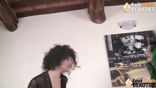 Barefoot lesbians playing hot footsies under the table