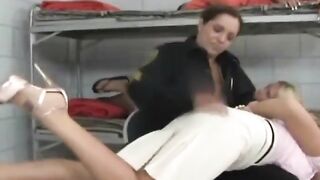Blonde spanked by policewoman