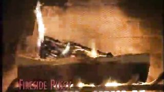 Young Charlie Laine and girlfriend by the fireplace