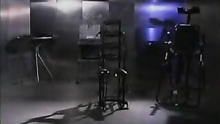 Latex mistress punishes captured brunette