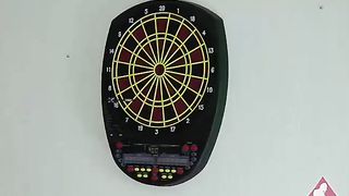 2 beautiful girls play a game of strip darts