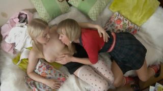 Horny blonde teens fuck with toys on the sofa