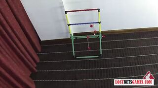 Two blondes play a strip game of throw the balls