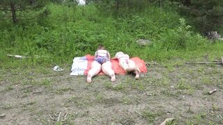 Mature lesbians with big asses in swimsuits sunbathe in nature and have fun with a rubber dick. Amateur fetish outdoor and juicy PAWG shaking doggystyle.