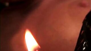 Slut puts lit candle and dildo in girl's cunt