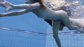 Enjoy a redhead underwater and lesbians