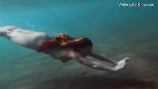 Enjoy a redhead underwater and lesbians