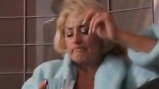 Hot mature blond gets her tits grabbed by hot young brunette